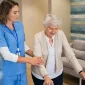 Caregiver providing elderly home care assistance to a senior in Houston